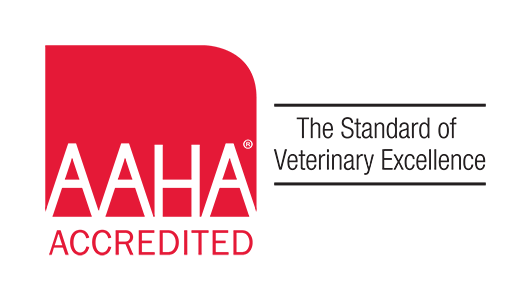 A red logo that says AAHA accredited - the standard of veterinary excellence